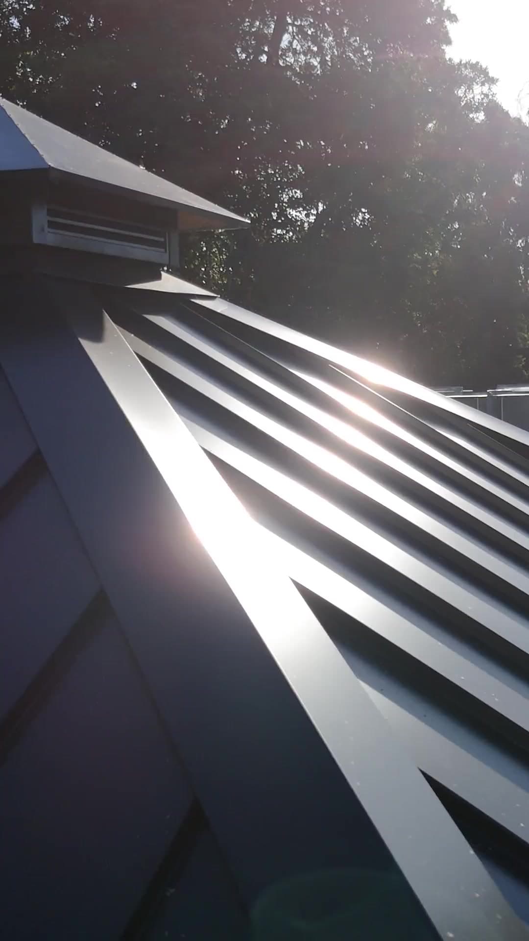 Virtue Roofing crew working on a metal roof in Perth