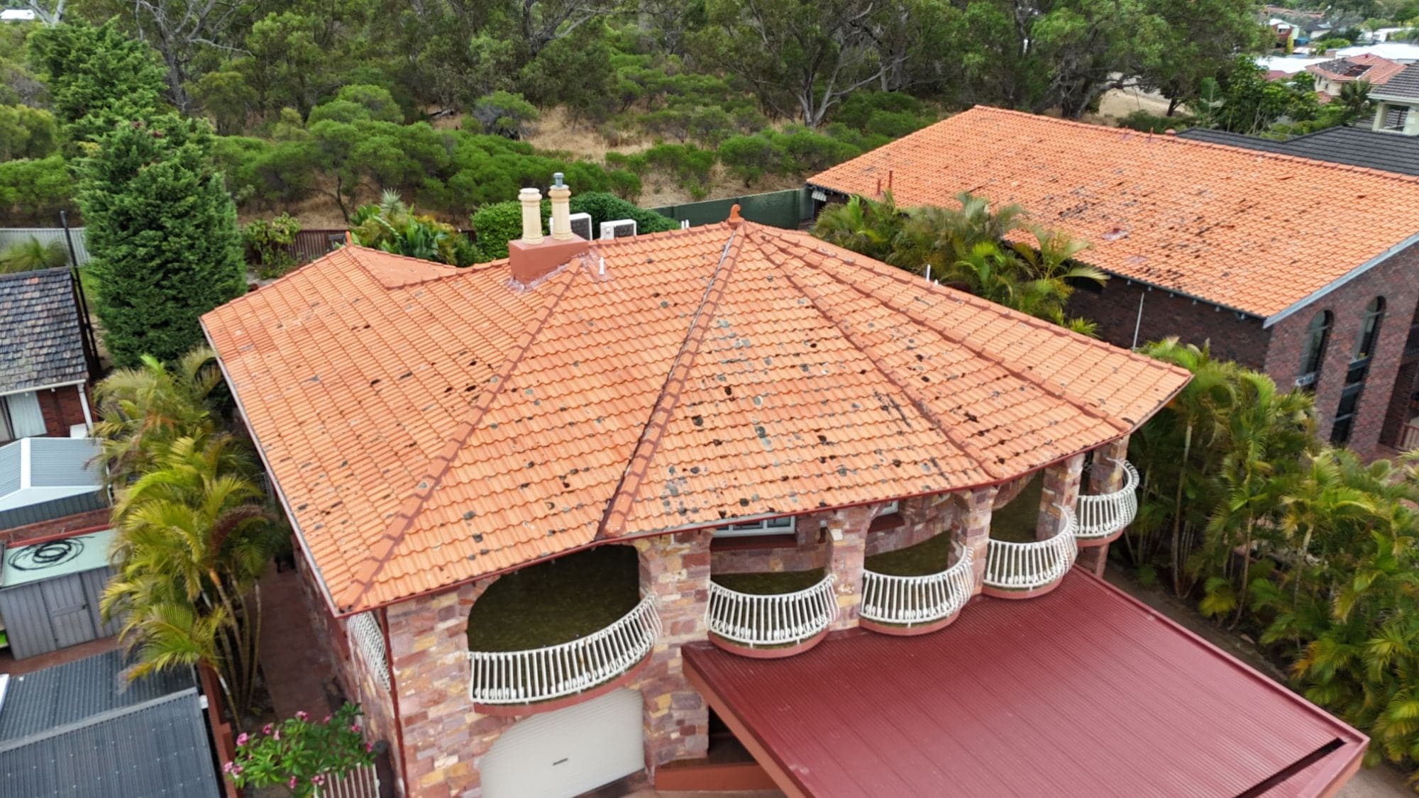 The same Karrinyup home before the re-roof, with old terracotta roof tiles