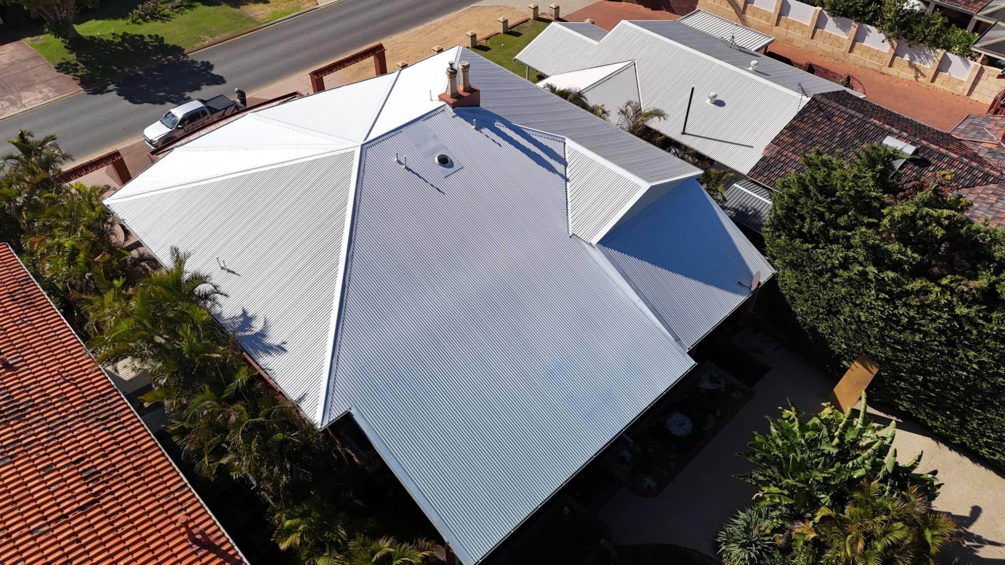 New Colorbond Surfmist roof from the street side, with a Virtue Roofing ute out the front, Karrinyup