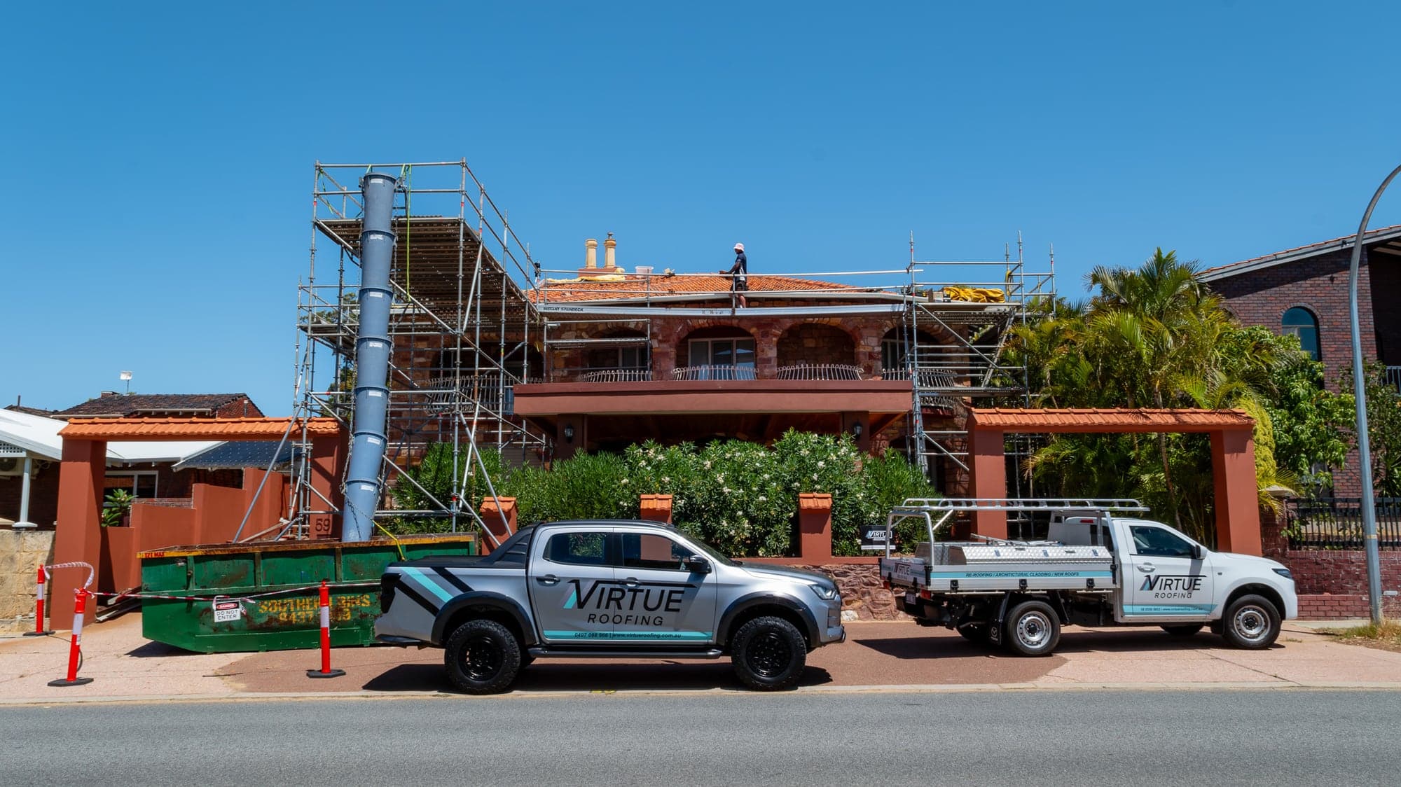 Virtue Roofing utes and scaffolding at a tile to Colorbond re-roof in Karrinyup, Perth