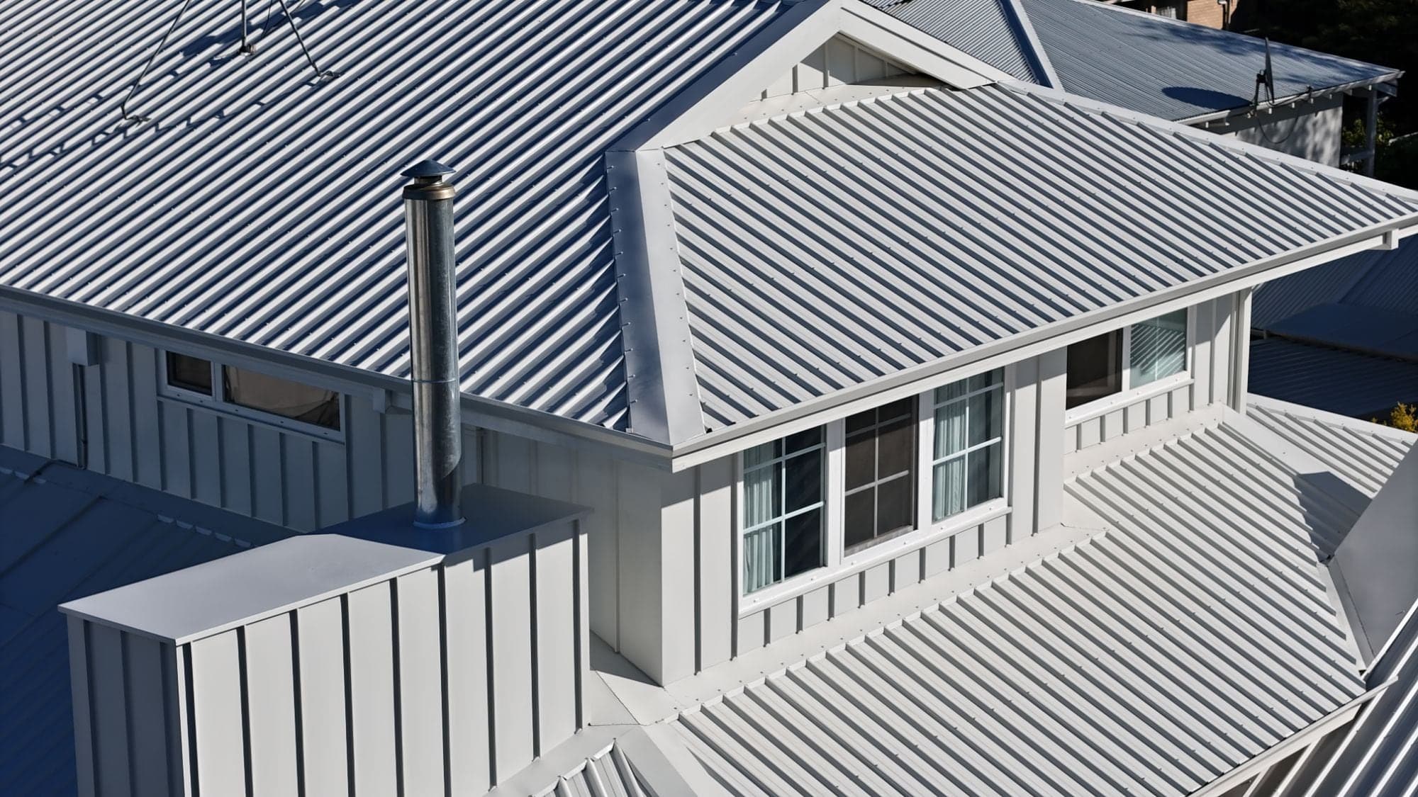 Dormer with standing seam cladding, ridge and flashings on a Surfmist metal roof in Scarborough, Perth