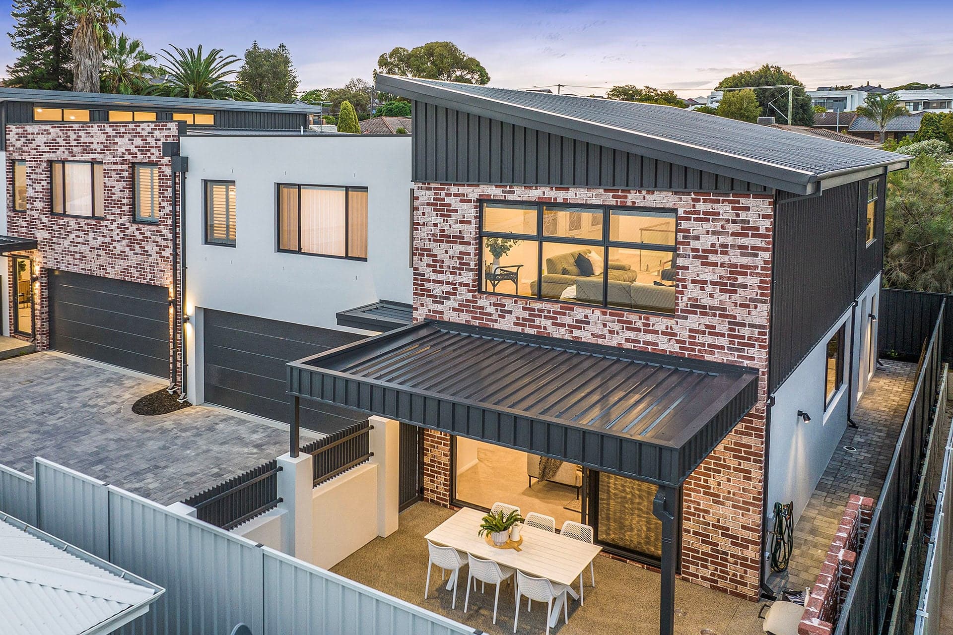Metal roofs and patio roof on new brick townhouses in Yokine, Perth